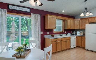 Kitchen and dinette interior of Lake Holiday ranch home.