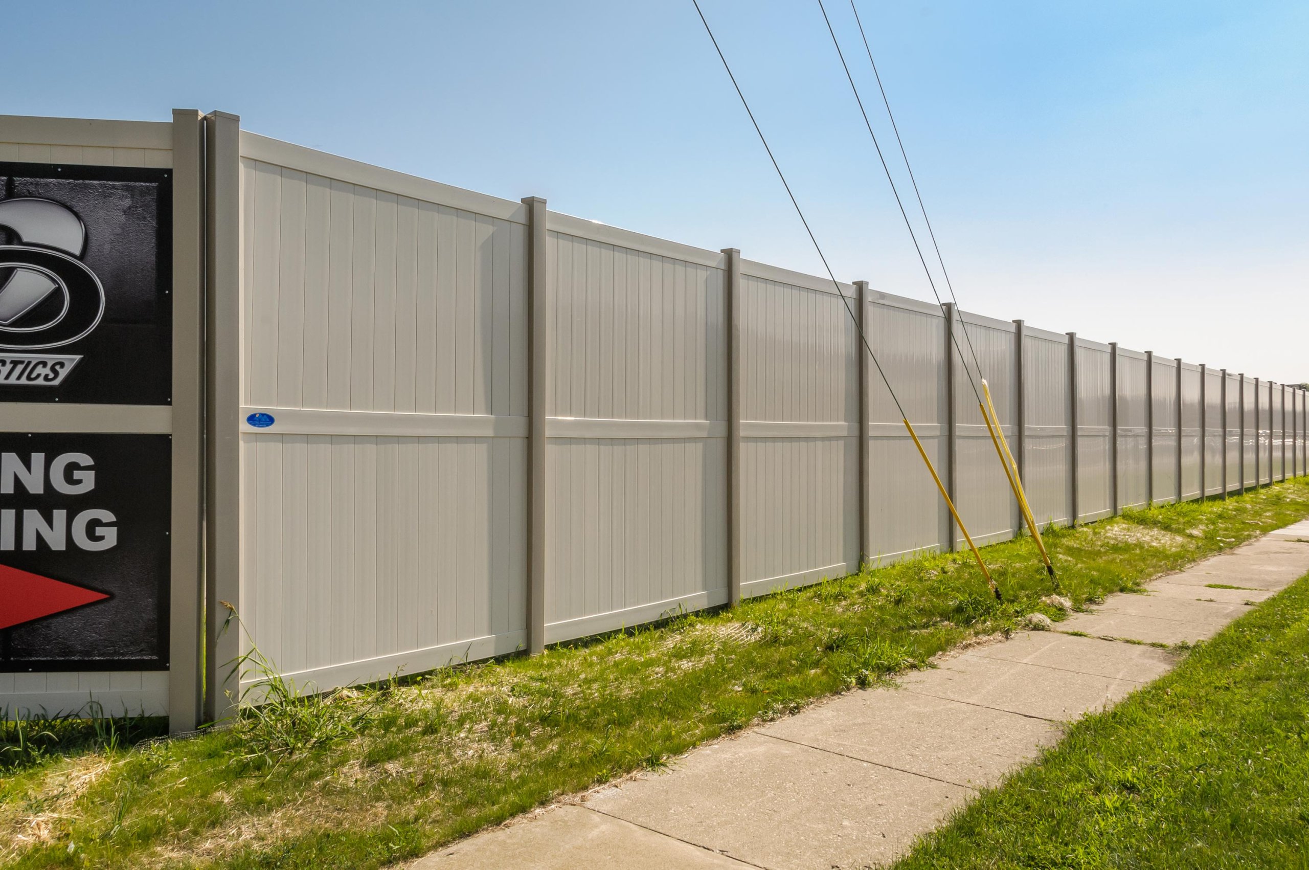 10' Rainer vinyl fence photo, fence-2 installed around warehouse in River Grove, Illinois